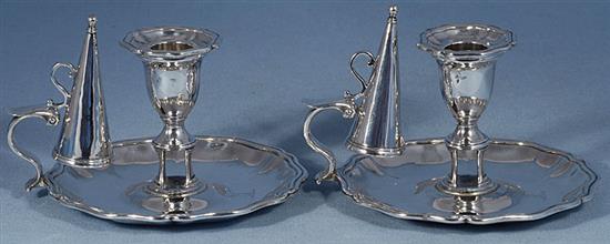 A pair of early Victorian silver chambersticks with conical snuffers, Height 4”/103mm Diameter 6”/155mm Combined weight 25.6oz/727gr